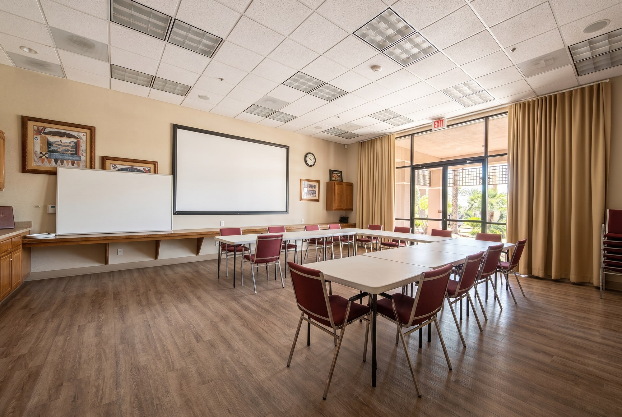 A club room at The Oasis clubhouse in Menifee set up with long tables for a meeting